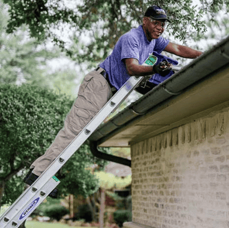 Window Genie Tech doing gutter cleaning