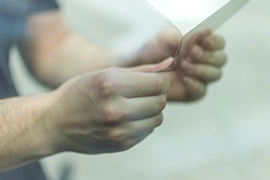 person removing window film.