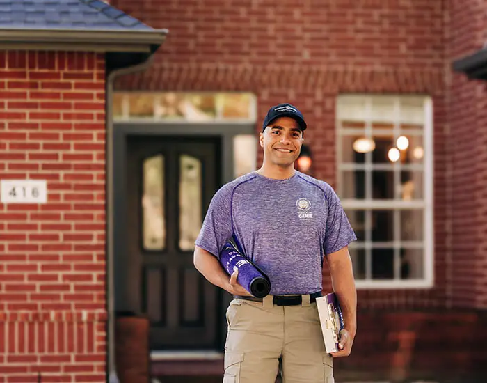 Window Genie tech outside a customer's home before a window cleaning appointment    