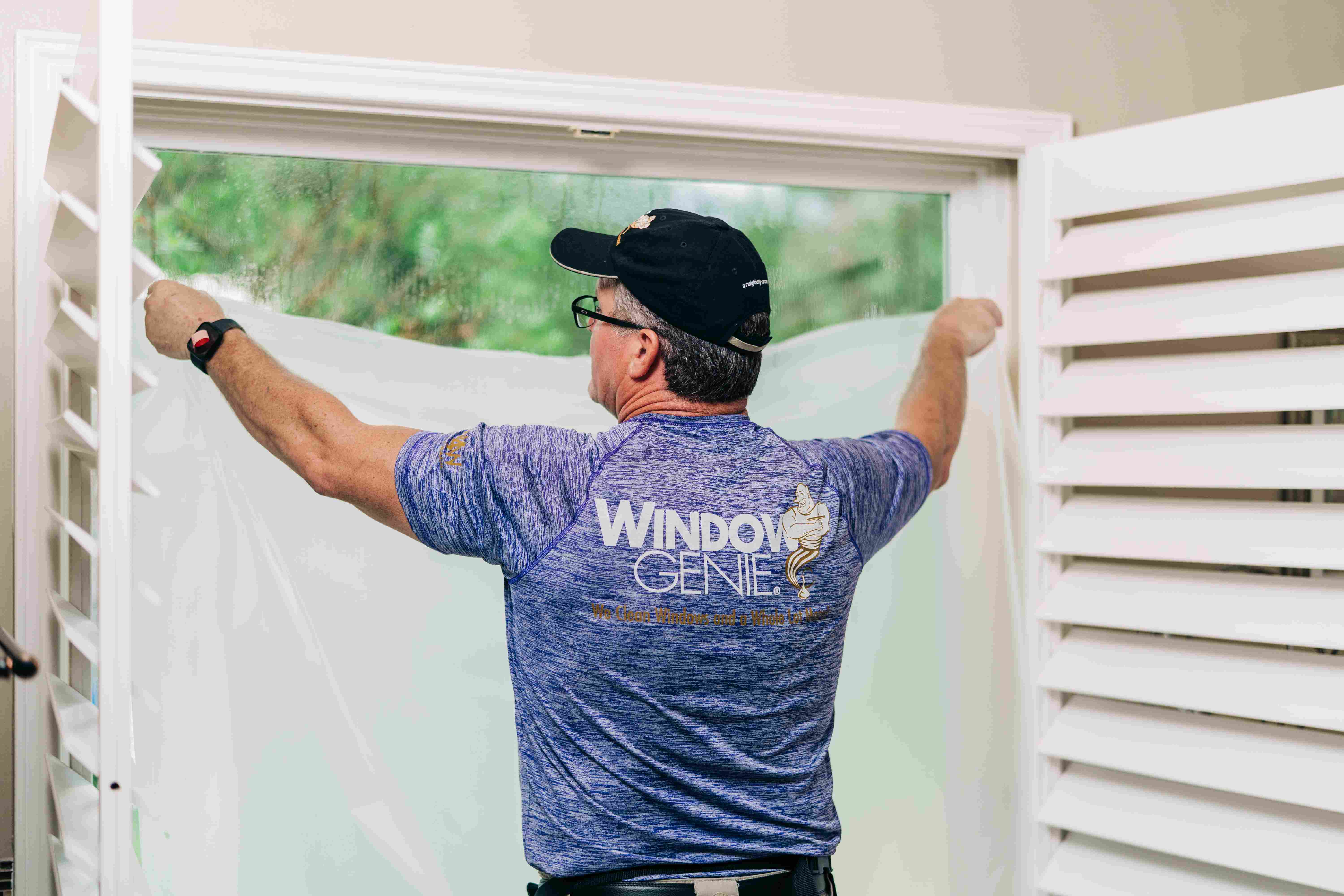 Window Genie tech installing residential window tinting 