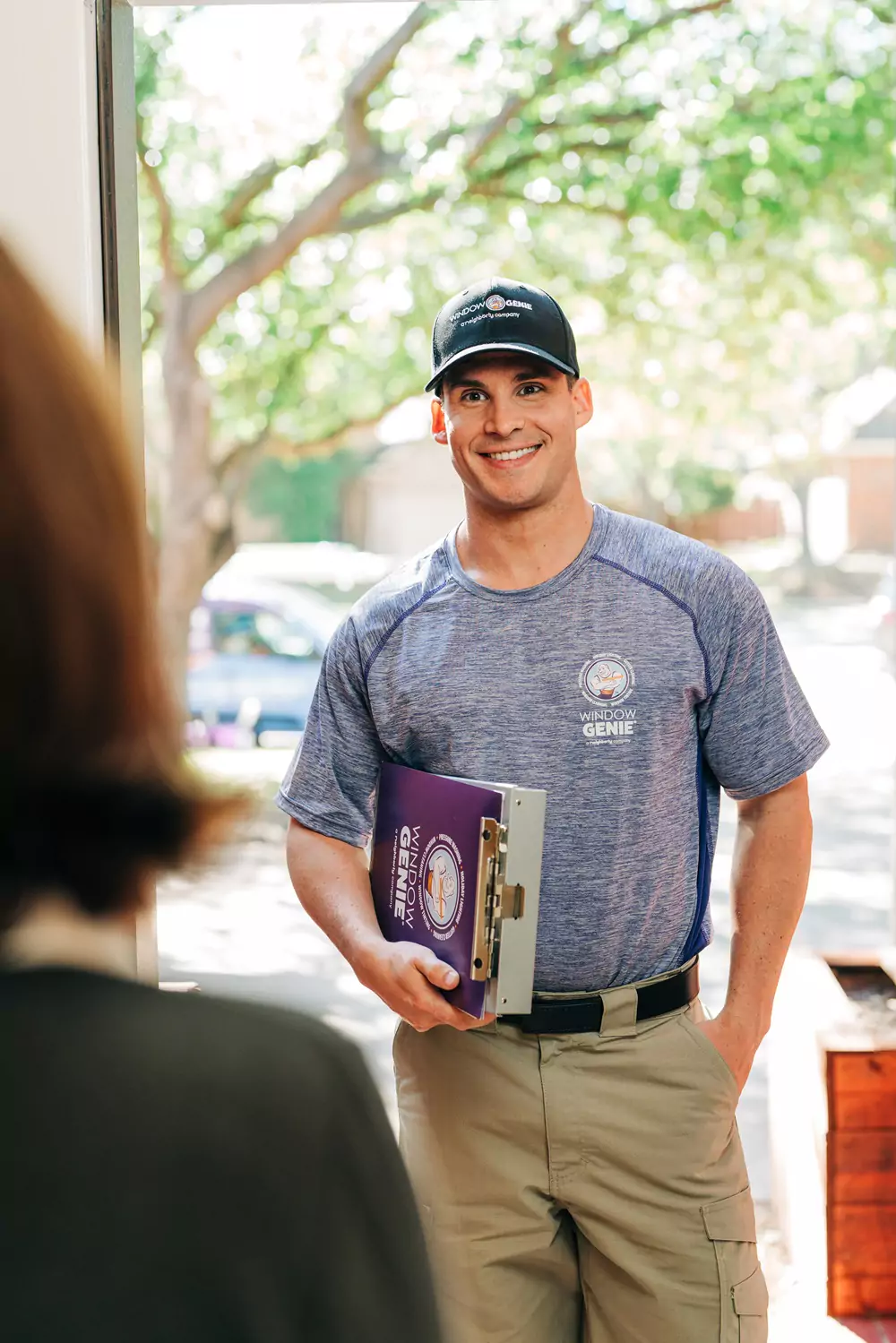 Window Genie professional interacting with customer.