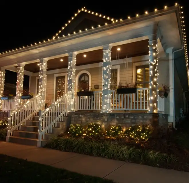 House Displaying Christmas Lights on Porch.