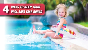 A kid playing in a pool.