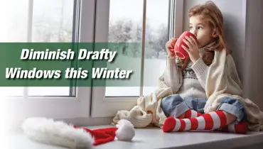 A little girl sipping from her mug and enjoying the beauty outside the window.