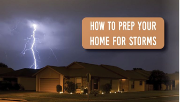 Lightning storm in the background over a home.