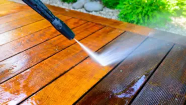 Pressure washing the deck.