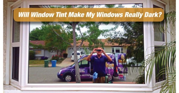 A man taking the picture of a window.