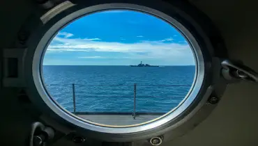 Window port of navy ship|Fishing boat.