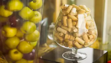 large glass corks. decorated. apples in a vase.