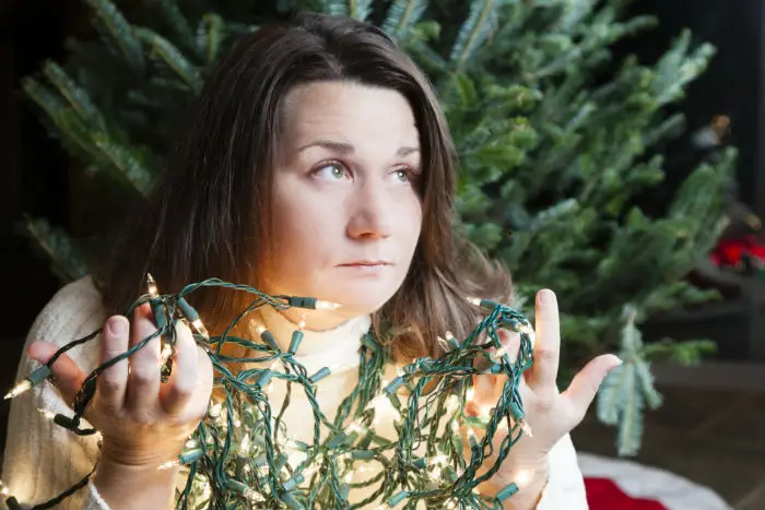 A lady with christmas lights